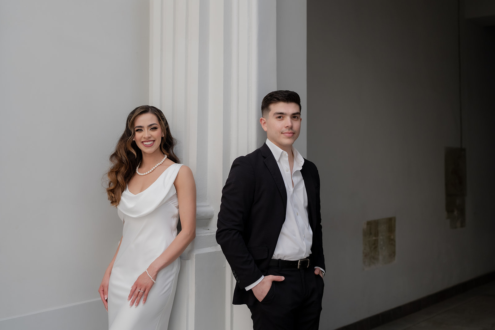 Kelsey Margarita and José Elías in an elegant doorway